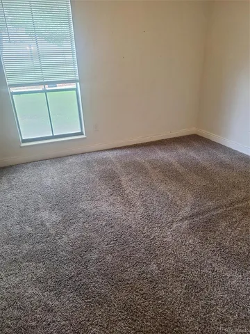 an empty room with a fireplace