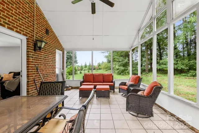 a view of a patio with couches chairs dining table and chairs