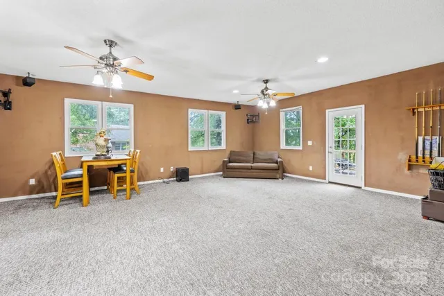 a view of a livingroom with furniture and a window