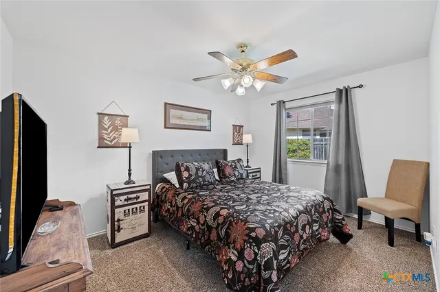 a view of a table and chairs under an umbrella