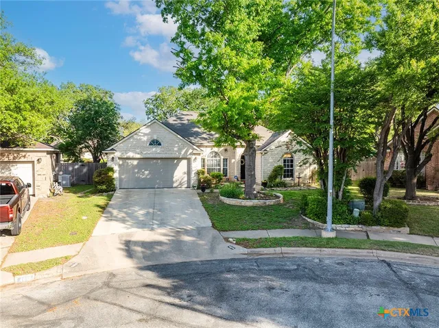 a living room with furniture chandelier and a chandelier