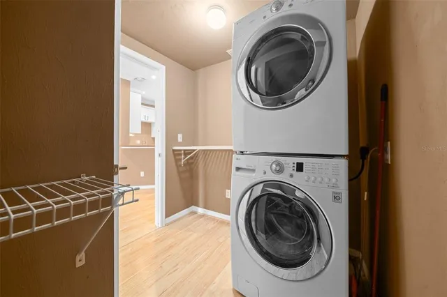 a view of a storage & utility room with a washer dryer