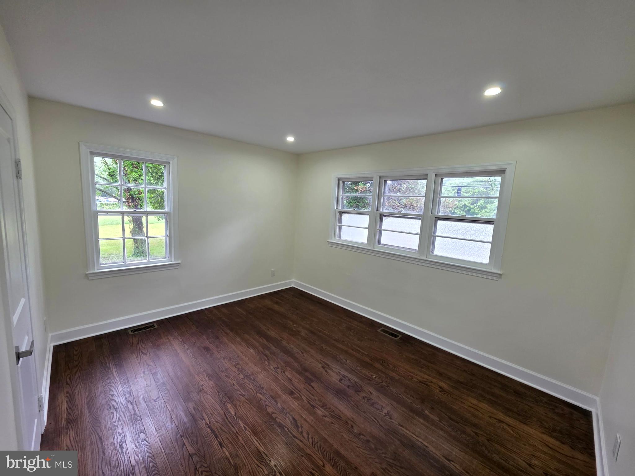 2206 Brinkley Road Fort Washington, MD 20744 - Photo 56 of 78 a view of an empty room with wooden floor and a window