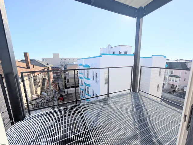 a view of a balcony with furniture