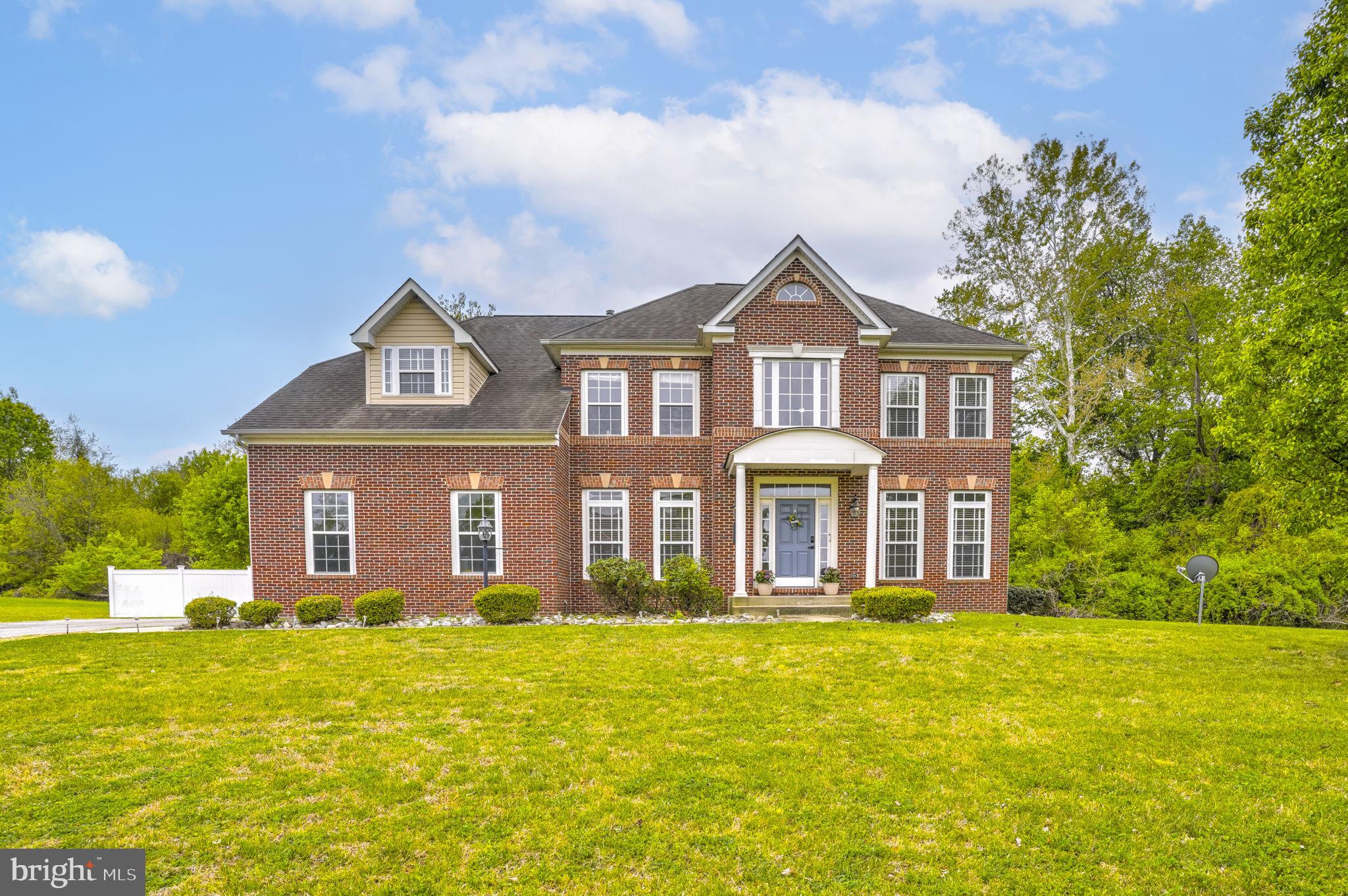 1507 St Albans Lane Accokeek, MD 20607 - Photo 1 of 36 a front view of a house with swimming pool and porch