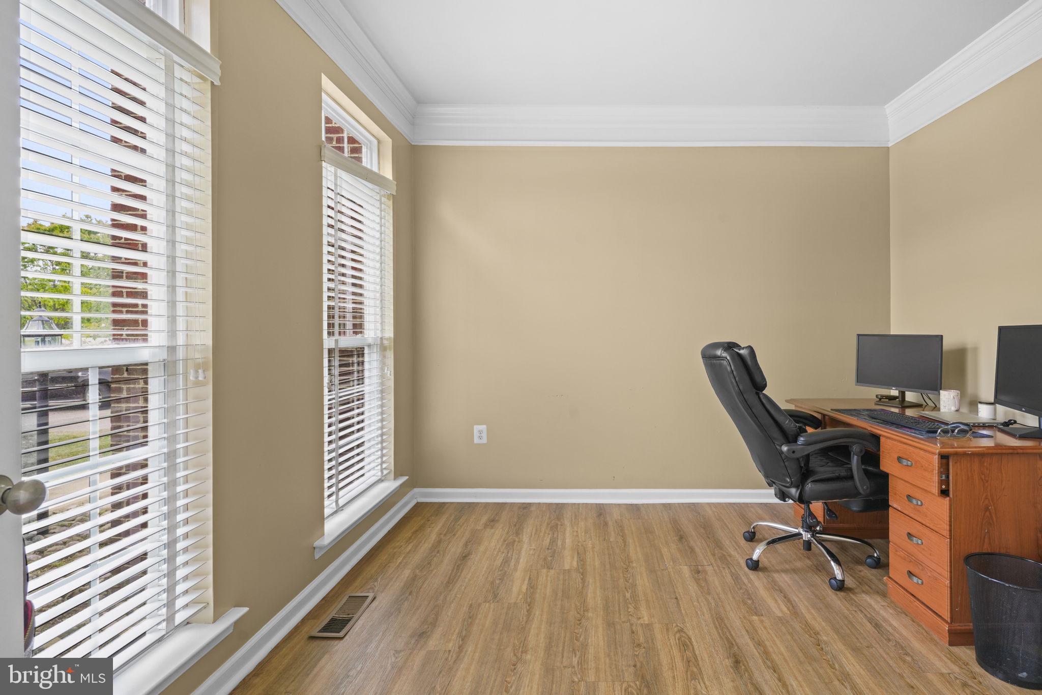 1507 St Albans Lane Accokeek, MD 20607 - Photo 12 of 36 a view of a workspace with furniture and a window