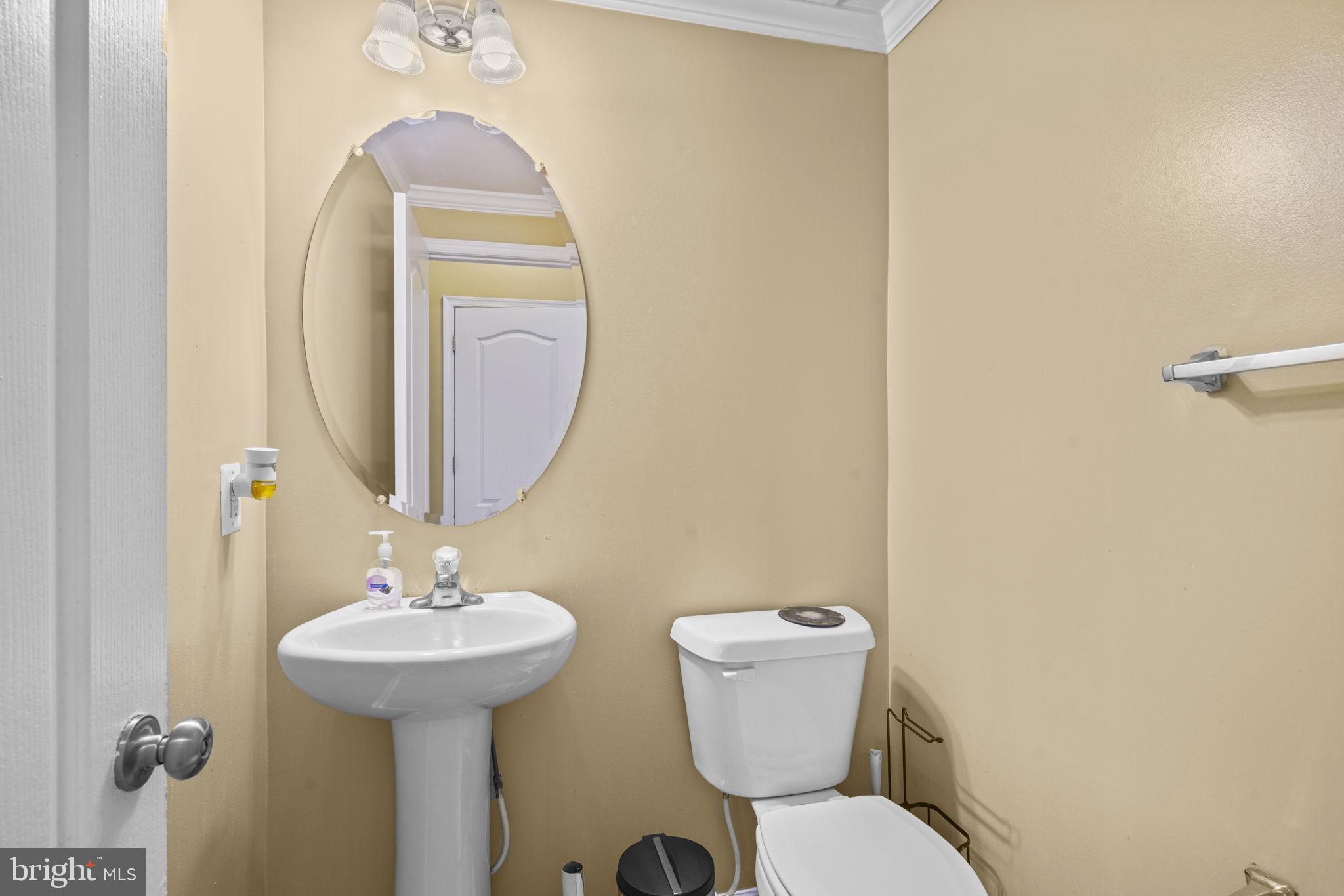 1507 St Albans Lane Accokeek, MD 20607 - Photo 13 of 36 a bathroom with a toilet sink and mirror