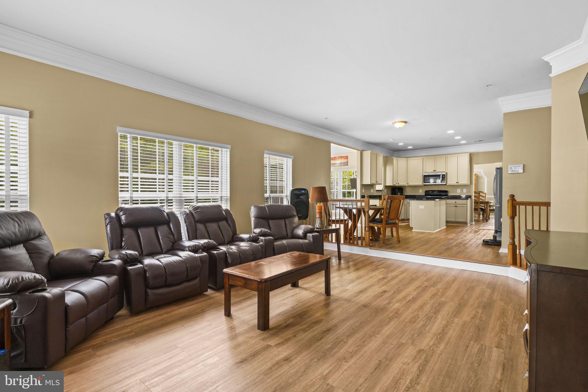 1507 St Albans Lane Accokeek, MD 20607 - Photo 18 of 36 a living room with furniture a wooden floor and a window