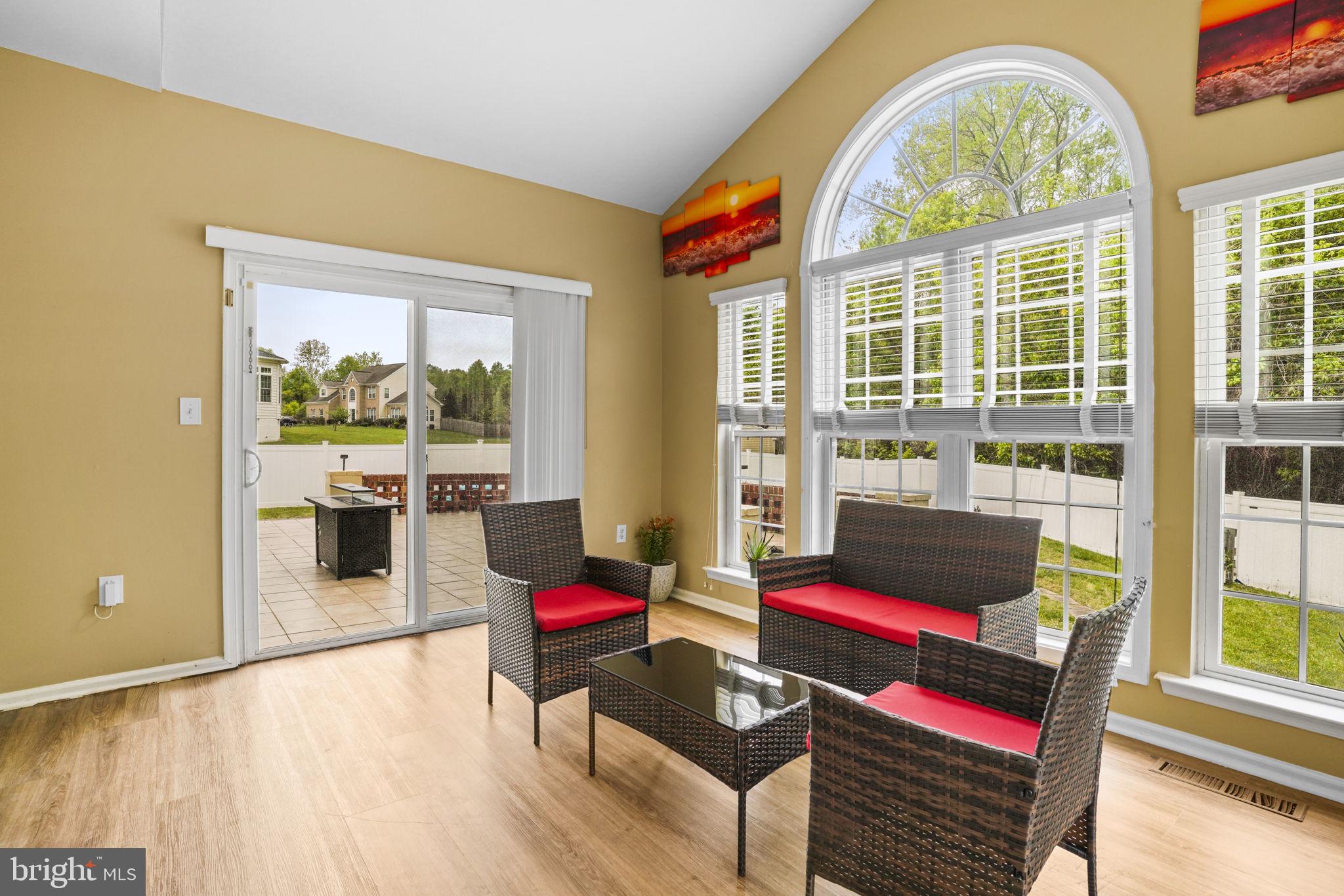 1507 St Albans Lane Accokeek, MD 20607 - Photo 23 of 36 a living room with furniture and a floor to ceiling window
