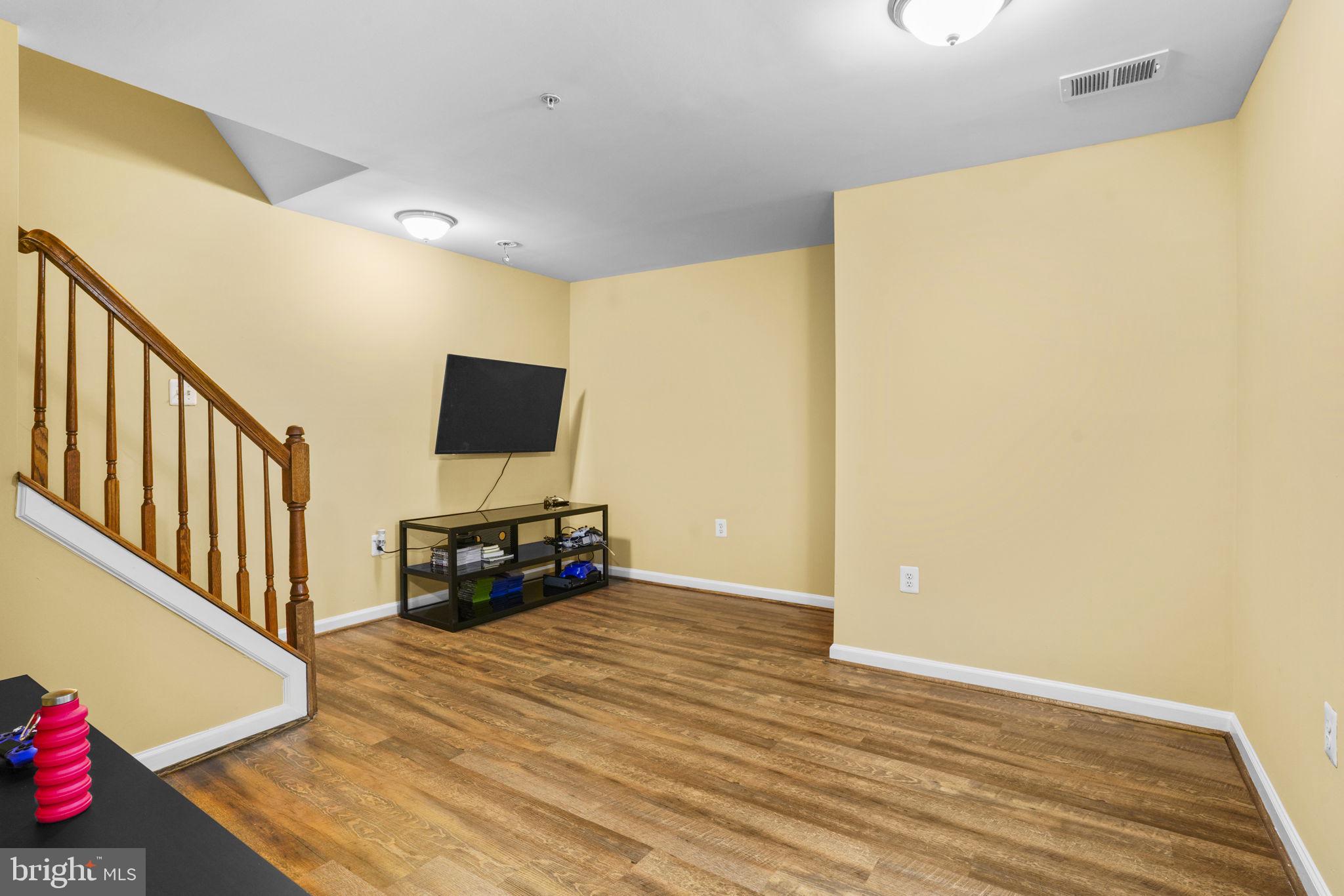 1507 St Albans Lane Accokeek, MD 20607 - Photo 29 of 36 a view of a livingroom with wooden floor and furniture