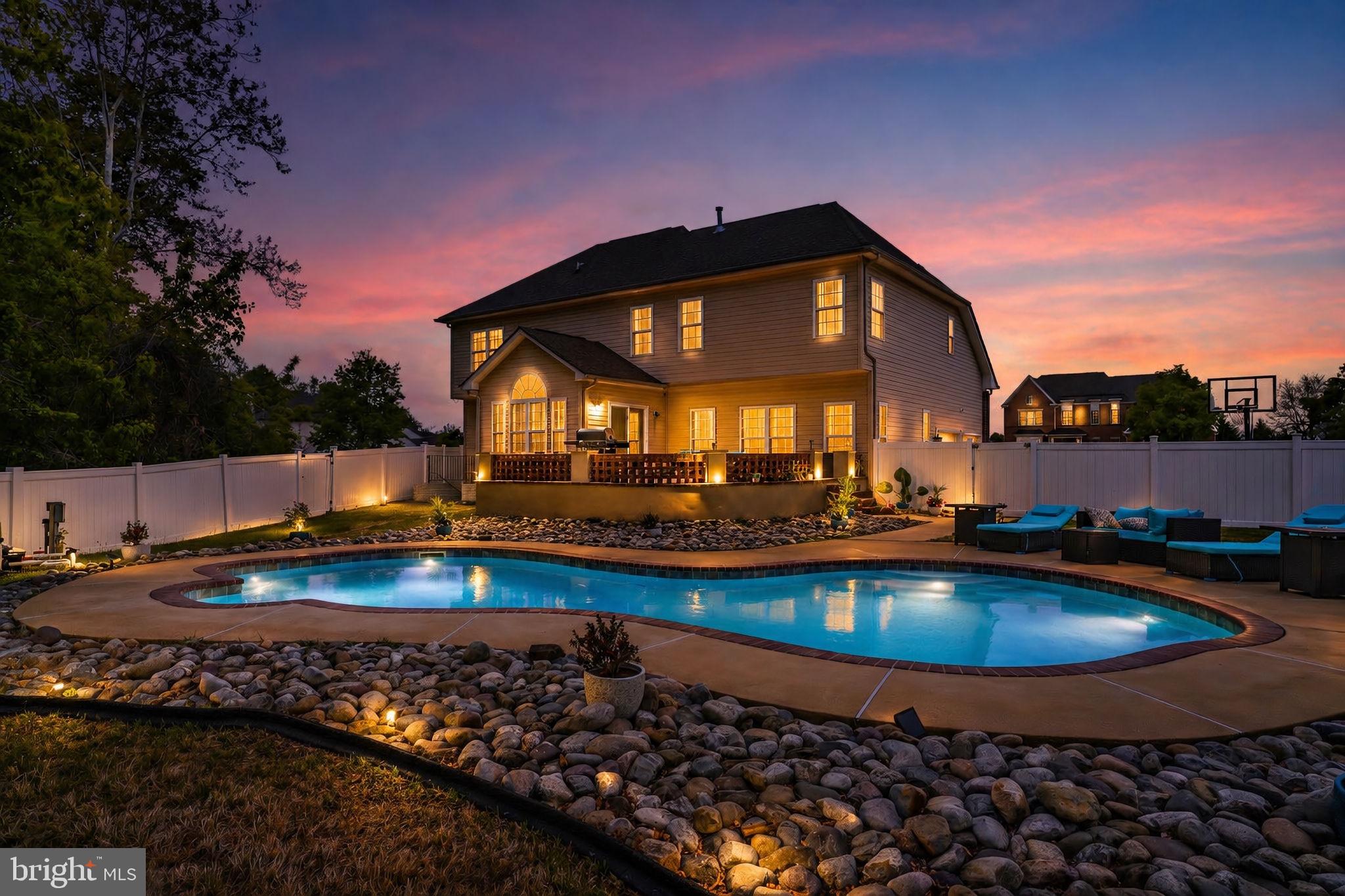 1507 St Albans Lane Accokeek, MD 20607 - Photo 3 of 36 a view of a swimming pool with outdoor seating