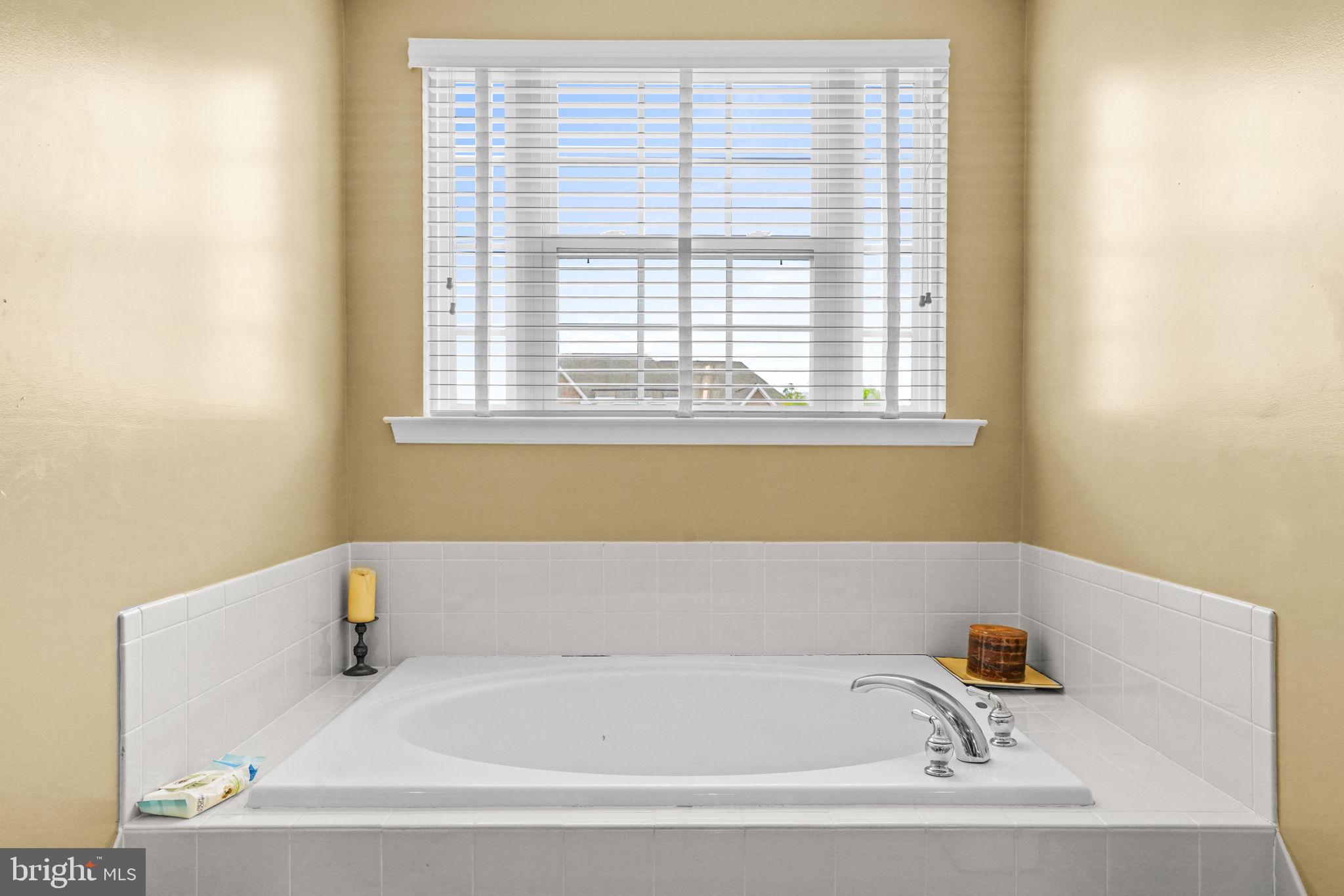 1507 St Albans Lane Accokeek, MD 20607 - Photo 33 of 36 a bathroom with bathtub and window