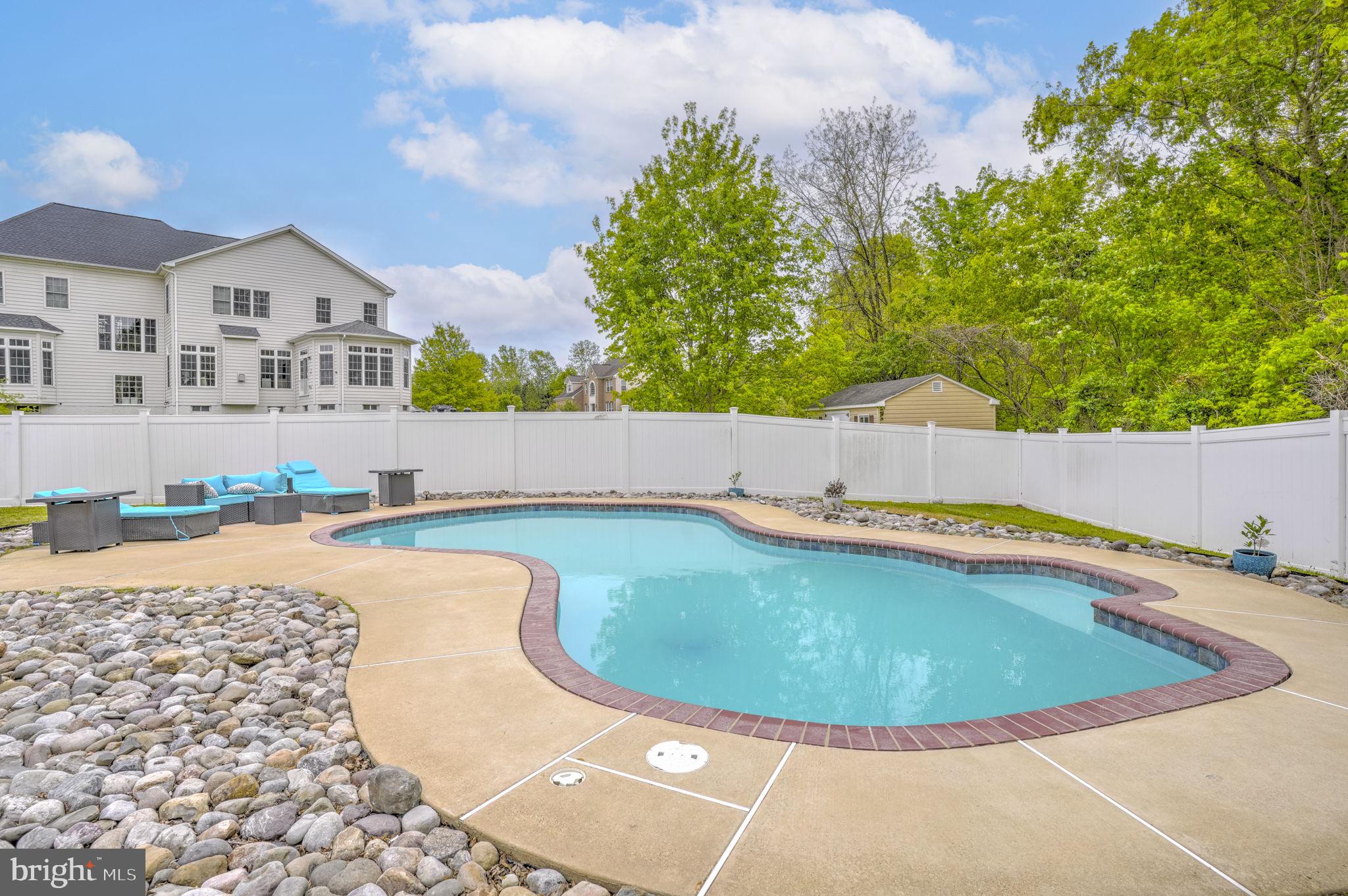 1507 St Albans Lane Accokeek, MD 20607 - Photo 4 of 36 a view of a swimming pool with an outdoor space