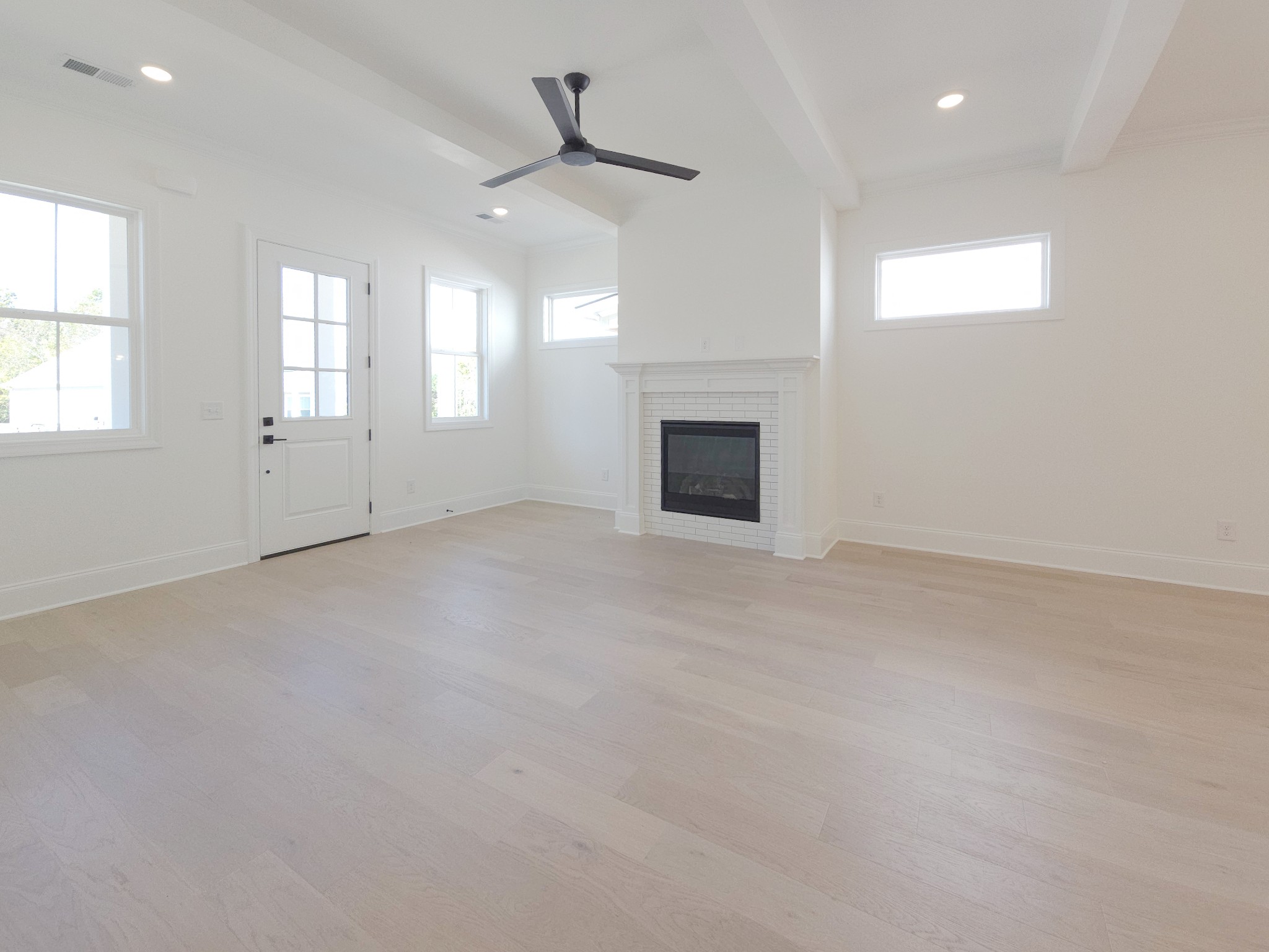7147 Frances Street Fairview, TN 37062 - Photo 5 of 45 an empty room with windows and fireplace