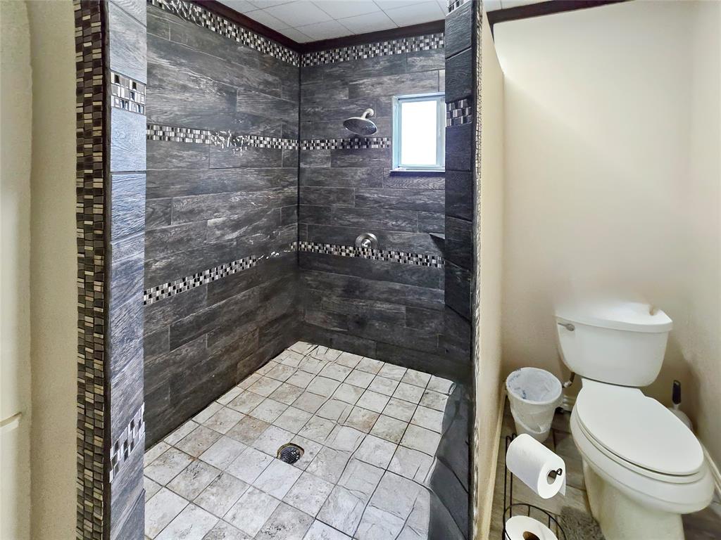 502 Griffith Avenue Terrell, TX 75160 - Photo 13 of 25 a bathroom with a toilet