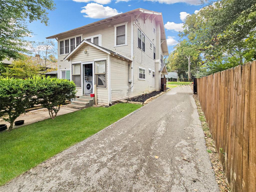 502 Griffith Avenue Terrell, TX 75160 - Photo 16 of 25 a front view of a house with a yard and trees