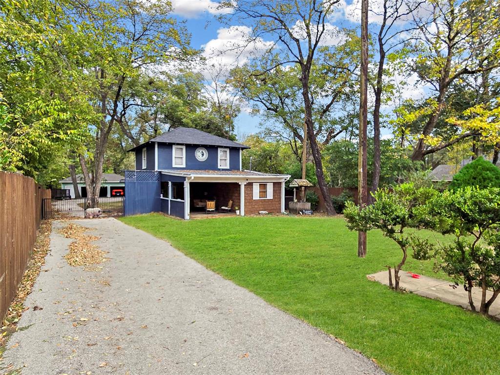 502 Griffith Avenue Terrell, TX 75160 - Photo 19 of 25 a front view of a house with a garden