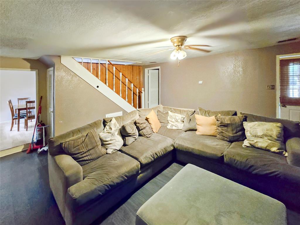 502 Griffith Avenue Terrell, TX 75160 - Photo 21 of 25 a living room with furniture and wooden floor