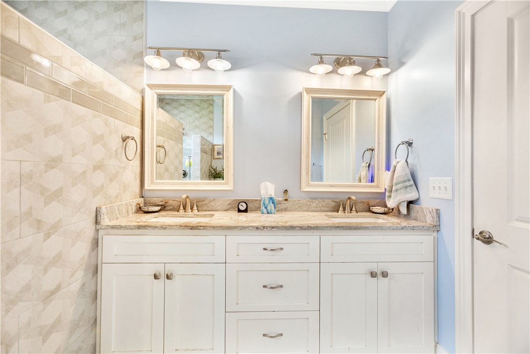 1204 Cherokee Road Townville, SC 29689 - Photo 24 of 44 Double vanities with sleek countertops provide ample space in this well-appointed bathroom.