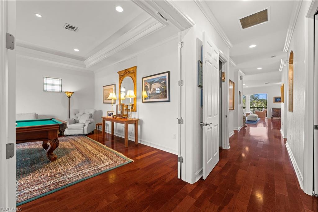 5045 Blauvelt Way, Unit 201 Naples, FL 34105 - Photo 18 of 39 a living room with furniture and a wooden floor