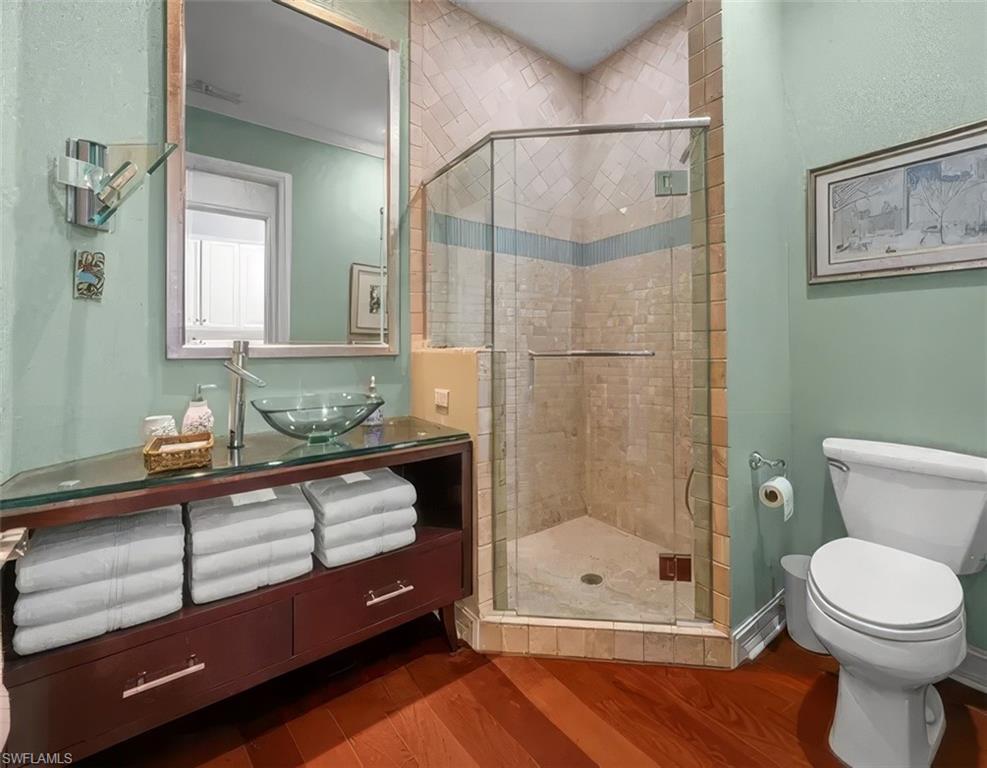 5045 Blauvelt Way, Unit 201 Naples, FL 34105 - Photo 26 of 39 a bathroom with a sink a toilet and shower