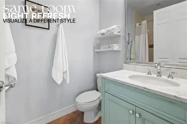 a bathroom with a granite countertop sink a toilet and a mirror