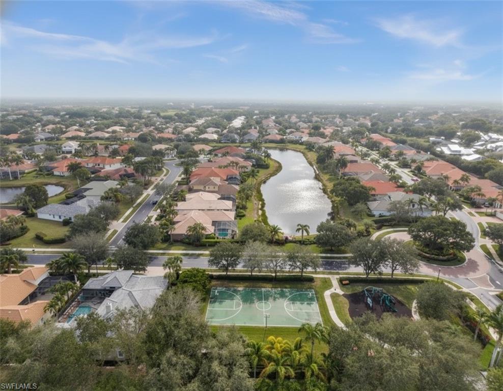 5045 Blauvelt Way, Unit 201 Naples, FL 34105 - Photo 37 of 39 an aerial view of residential building with outdoor space
