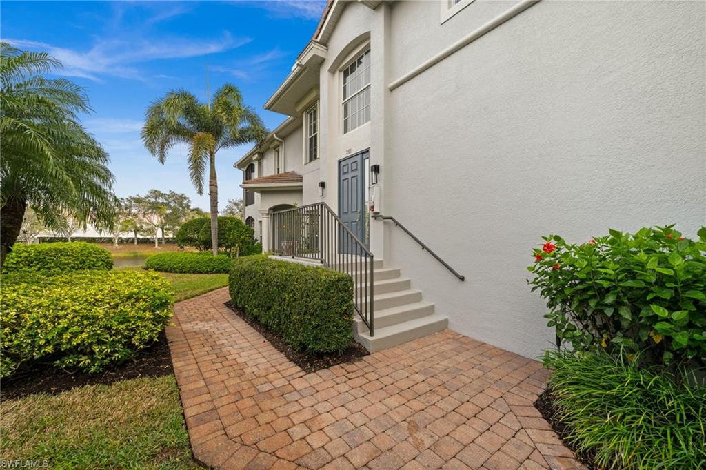 5045 Blauvelt Way, Unit 201 Naples, FL 34105 - Photo 38 of 39 a view of a house with a yard