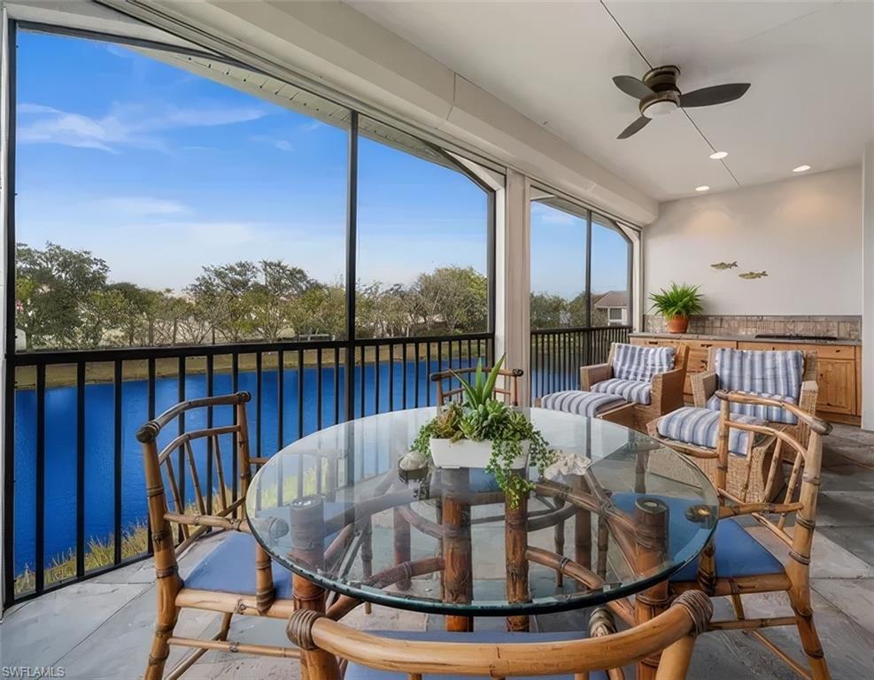 5045 Blauvelt Way, Unit 201 Naples, FL 34105 - Photo 6 of 39 a view of a dining room with furniture window and wooden floor