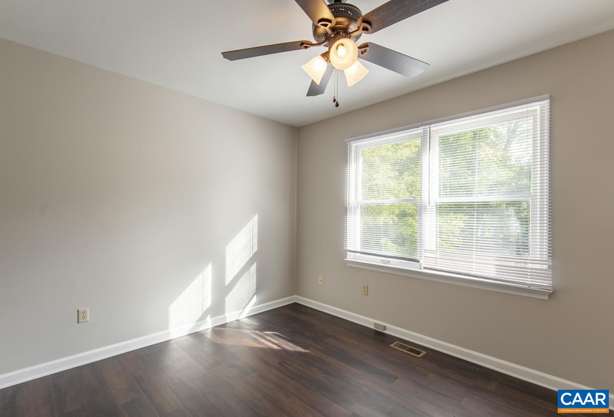 358 Westfield Road Charlottesville, VA 22901 - Photo 18 of 28 a view of an empty room with wooden floor and a window