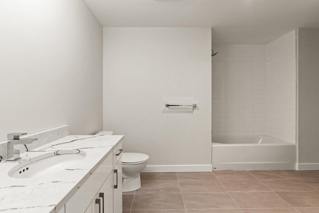 30 Collins Avenue Saugus, MA 01906 - Photo 32 of 35 a bathroom with a sink a toilet and shower