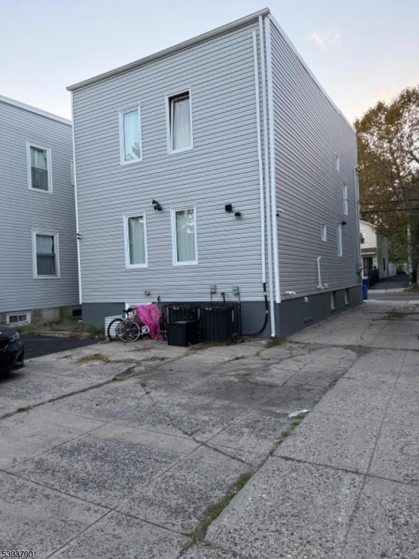 492 South 20th Street Newark, NJ 07103 - Photo 2 of 13 a front view of a house with a yard and garage