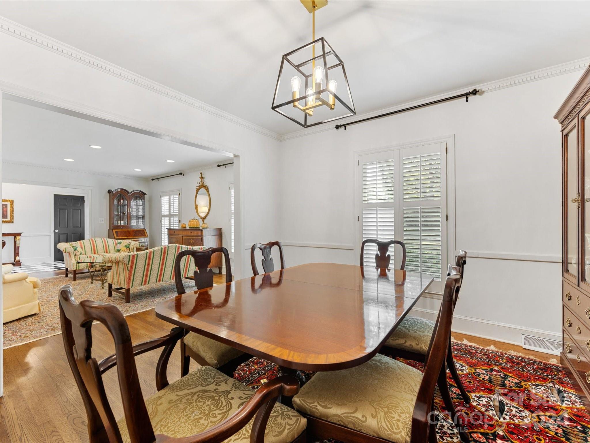 4233 Columbine Circle Charlotte, NC 28211 - Photo 12 of 47 a view of a dining room with furniture window and wooden floor