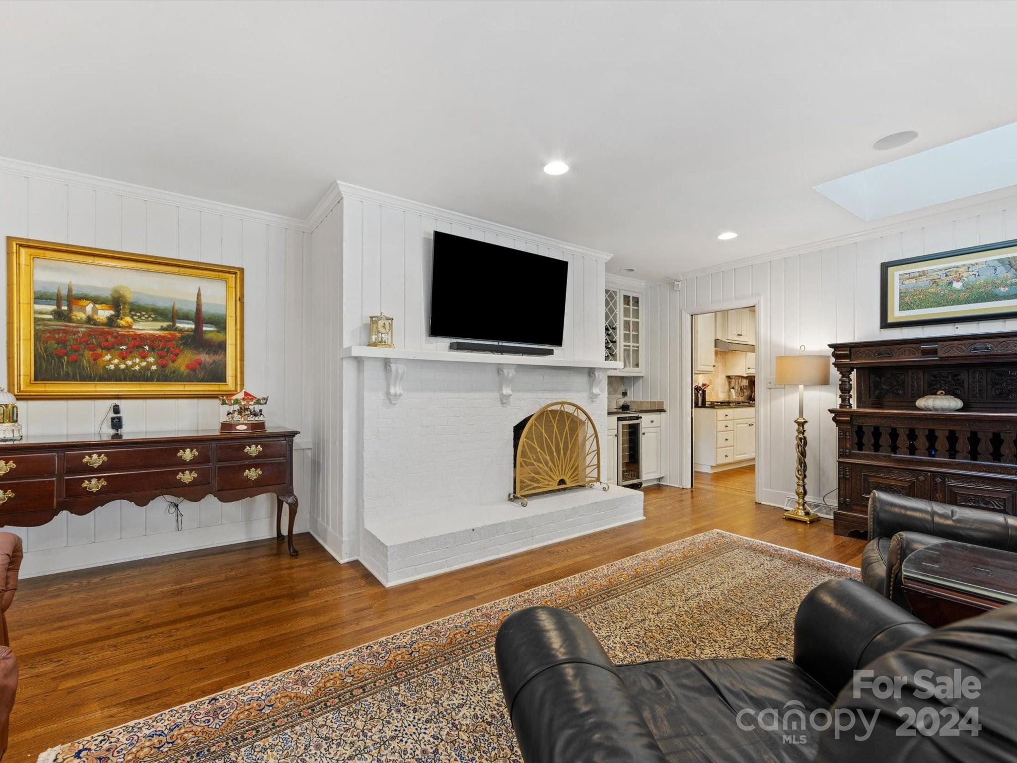 4233 Columbine Circle Charlotte, NC 28211 - Photo 17 of 47 a living room with furniture and a flat screen tv