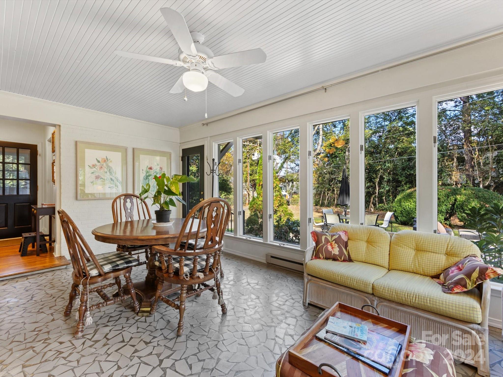 4233 Columbine Circle Charlotte, NC 28211 - Photo 18 of 47 a living room with furniture and large windows