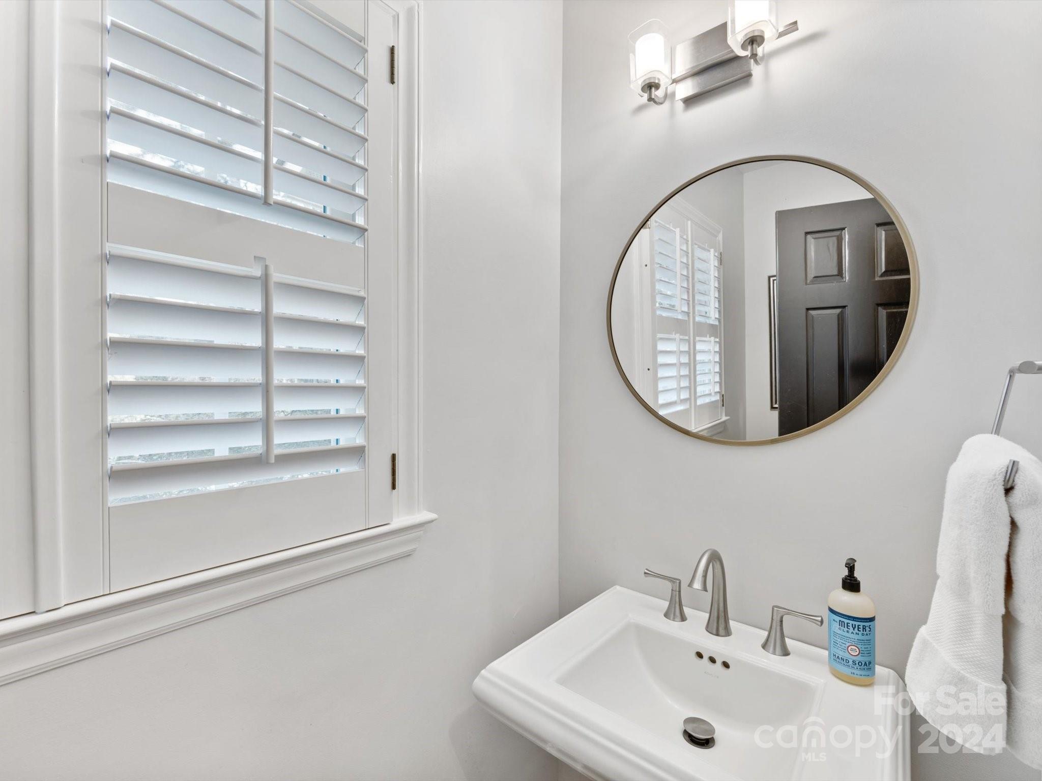 4233 Columbine Circle Charlotte, NC 28211 - Photo 29 of 47 a bathroom with a sink and a mirror