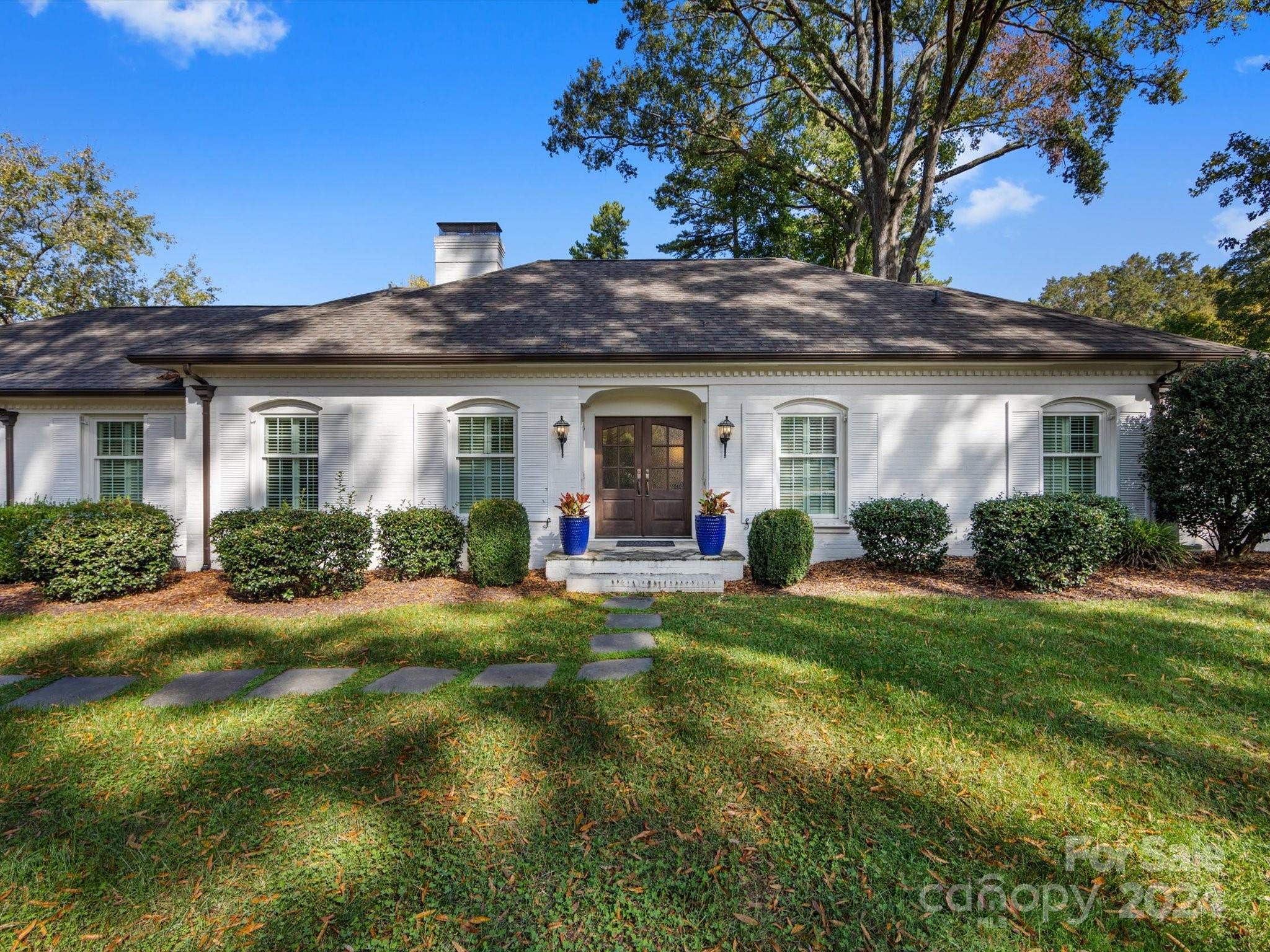 4233 Columbine Circle Charlotte, NC 28211 - Photo 3 of 47 a front view of a house with a yard