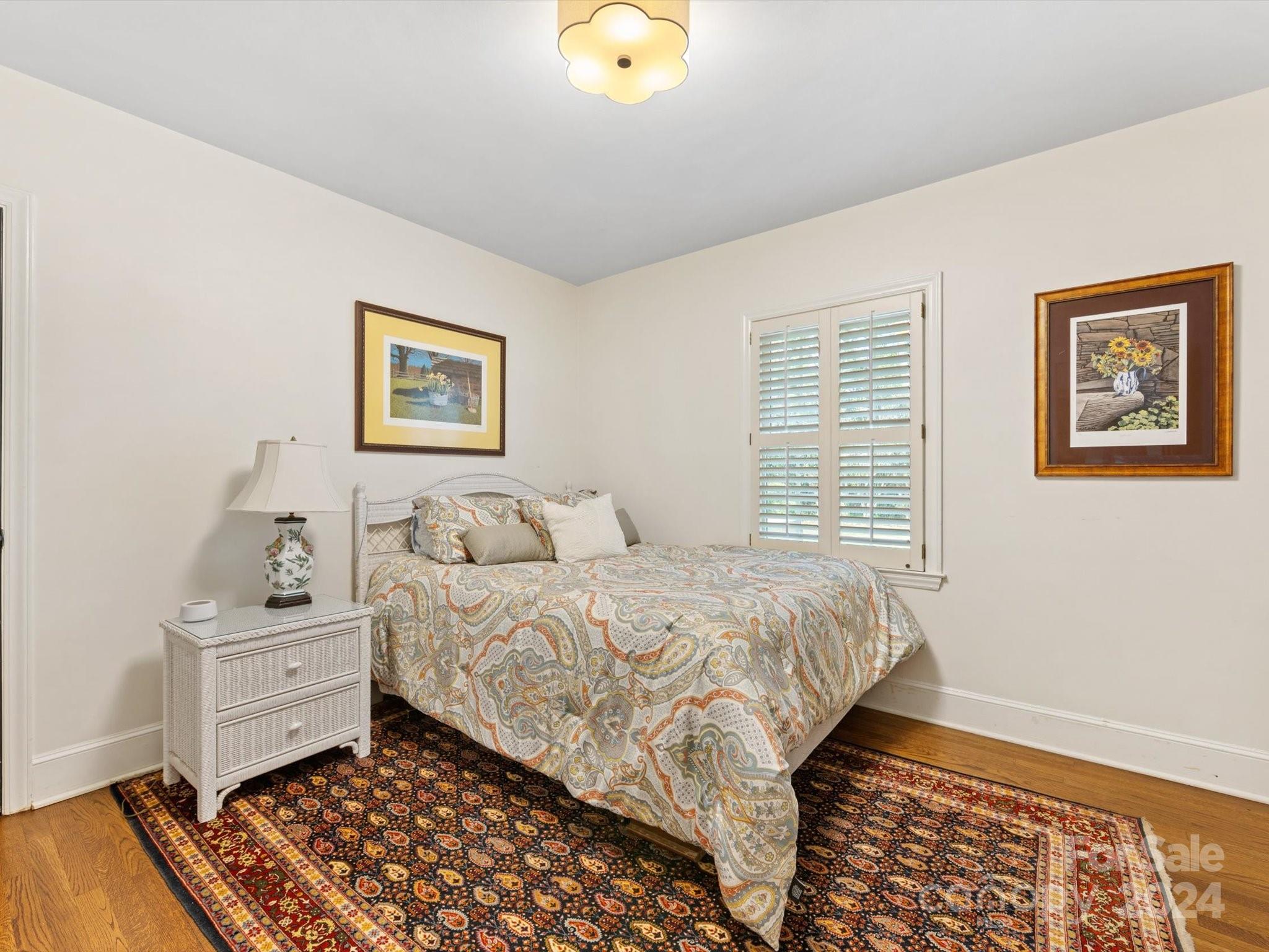 4233 Columbine Circle Charlotte, NC 28211 - Photo 39 of 47 a bedroom with a bed and a window