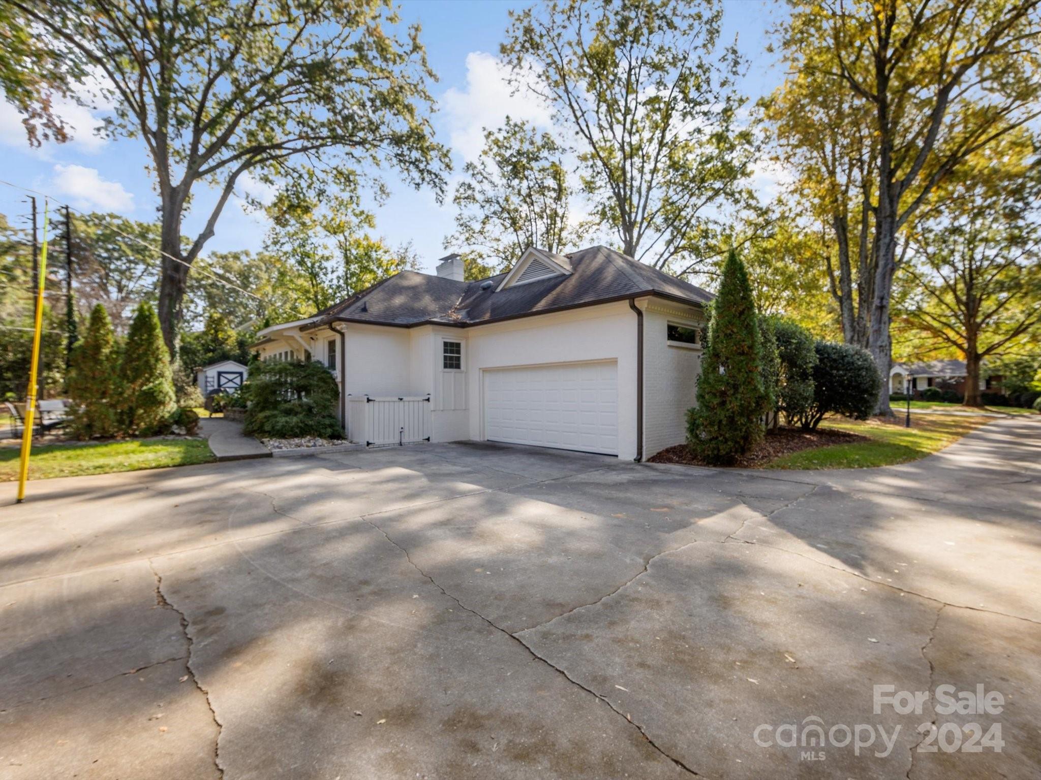 4233 Columbine Circle Charlotte, NC 28211 - Photo 40 of 47 a view of a house with a yard and garage