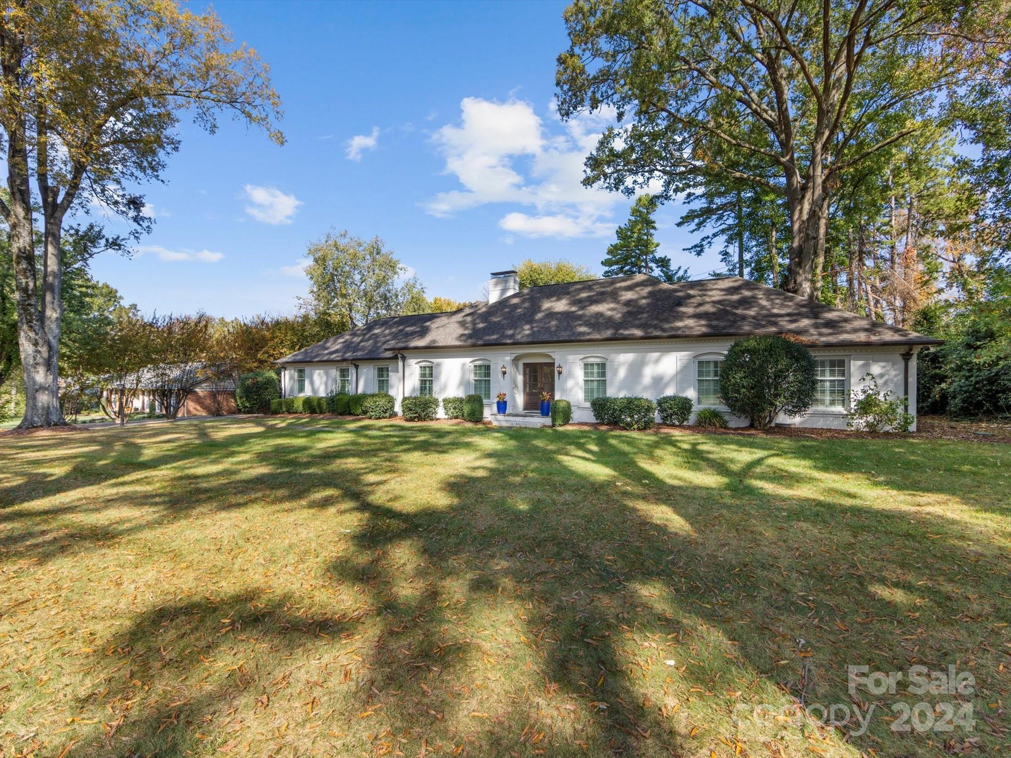 4233 Columbine Circle Charlotte, NC 28211 - Photo 46 of 47 a front view of a house with a garden