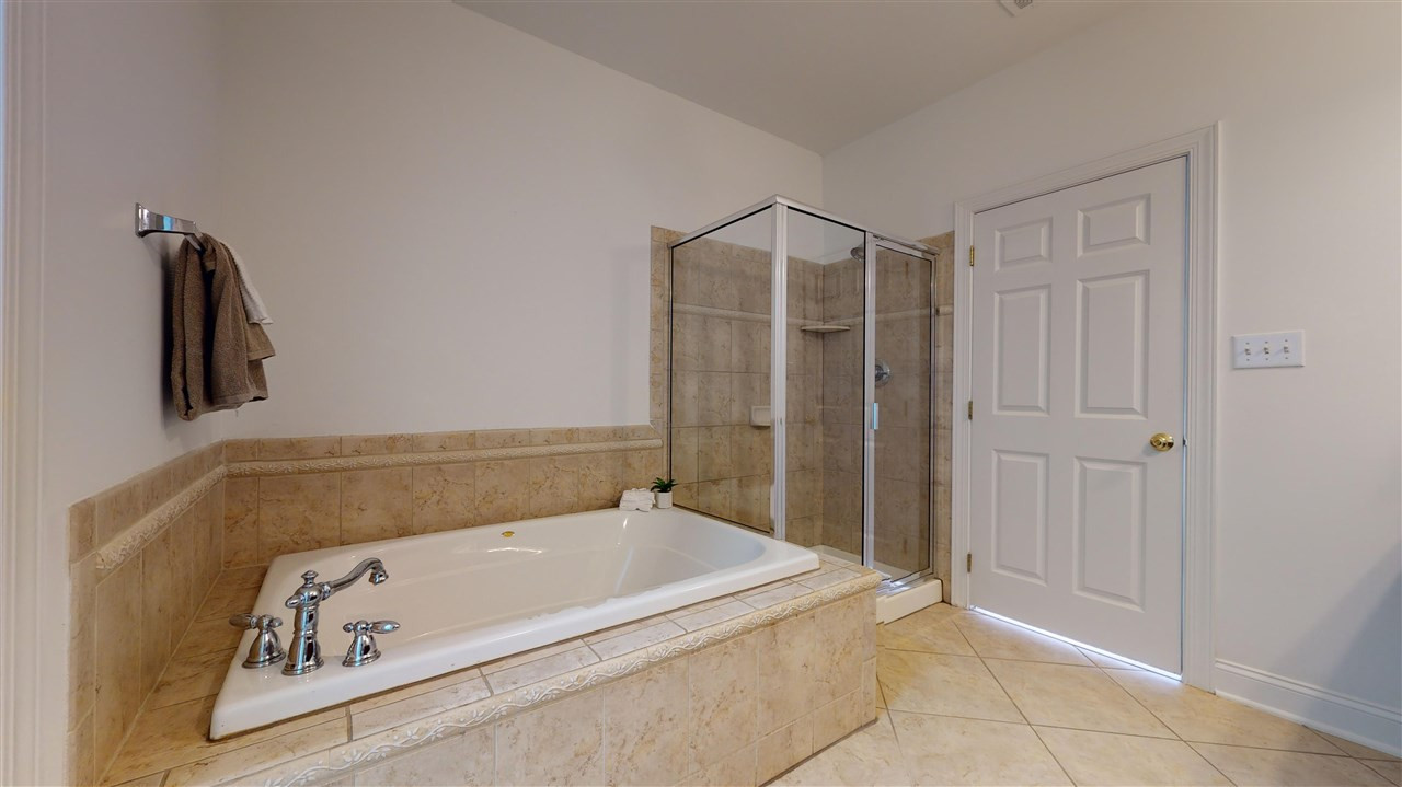 11245 Maplecroft Court Raleigh, NC 27617 - Photo 12 of 30 Generous 1st Floor Master Suite w/ luxurious garden tub, dual vanity, glass/tile shower, & oversized WIC. Master Bathroom