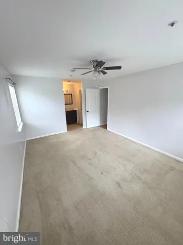 a view of a big room with windows and cabinet