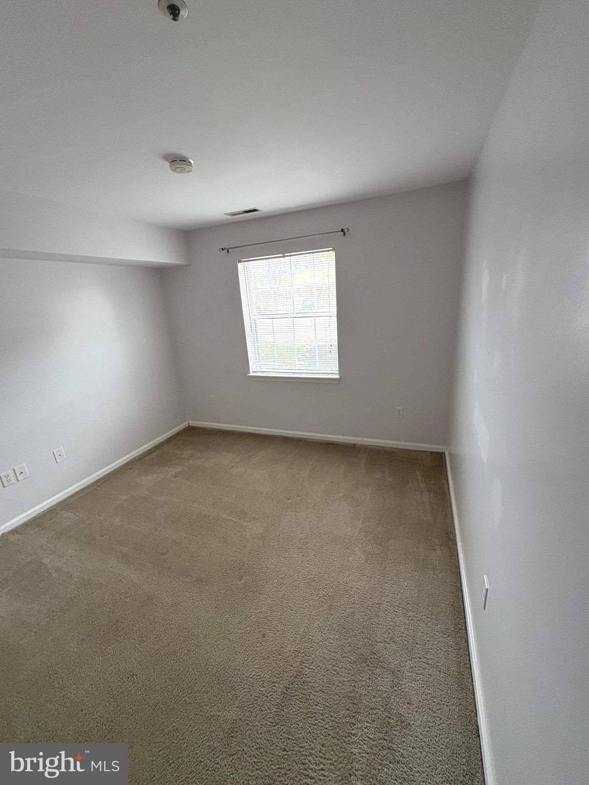 8489 Falls Run Road, Unit A Ellicott City, MD 21043 - Photo 14 of 15 an empty room with a window