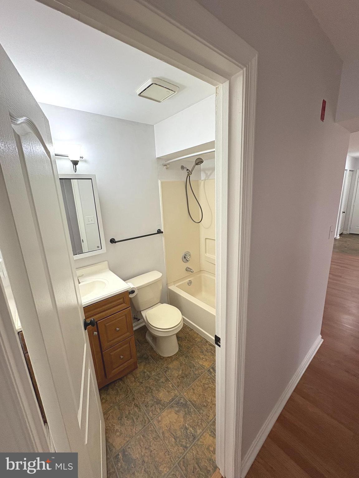 8489 Falls Run Road, Unit A Ellicott City, MD 21043 - Photo 15 of 15 a bathroom with a toilet and a shower