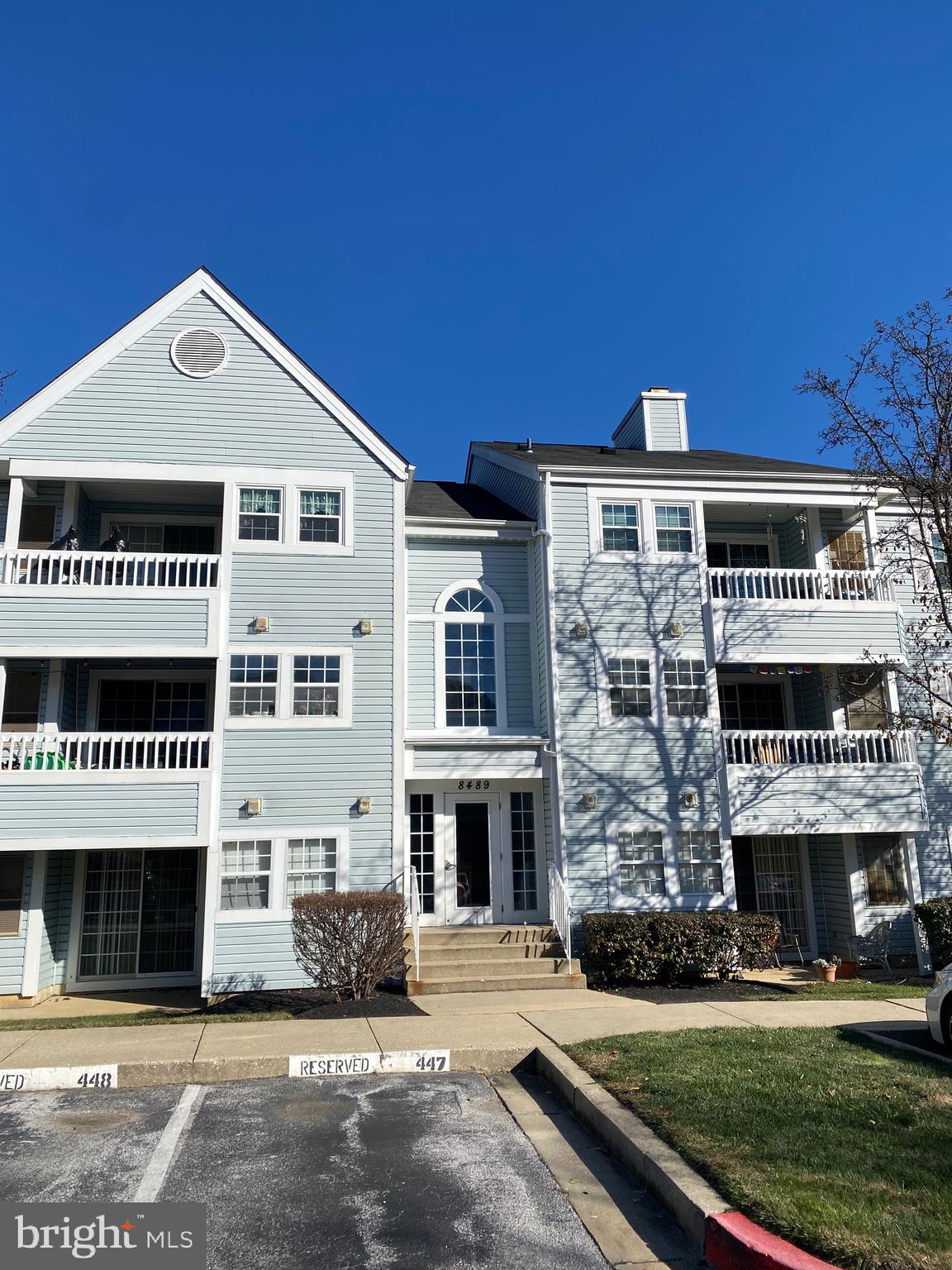 8489 Falls Run Road, Unit A Ellicott City, MD 21043 - Photo 2 of 15 a front view of a house with a yard