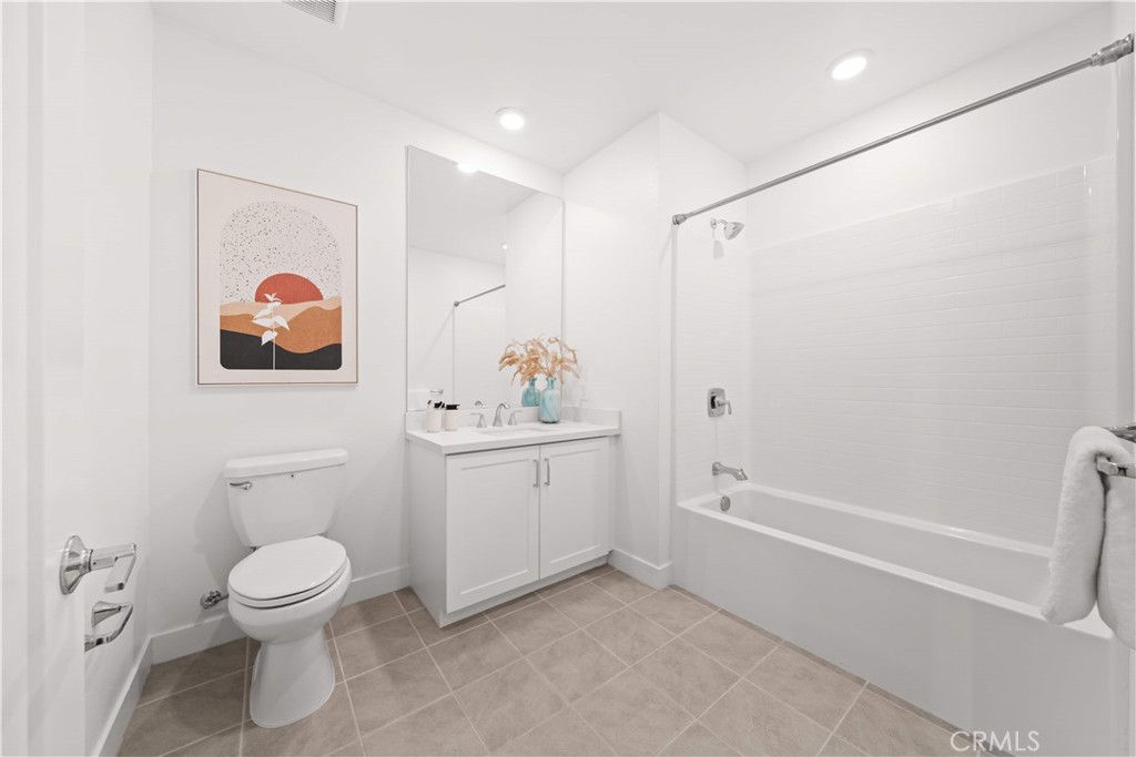 2510 Rivington Irvine, CA 92612 - Photo 11 of 41 a bathroom with a toilet sink and mirror