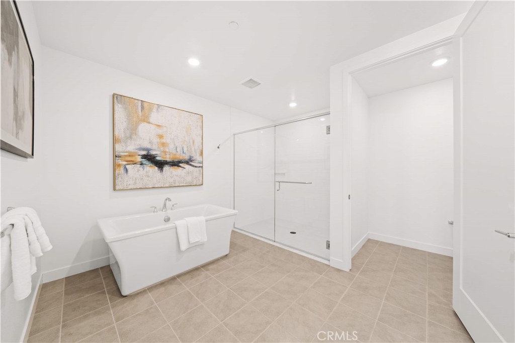 2510 Rivington Irvine, CA 92612 - Photo 26 of 41 a spacious bathroom with a bathtub and a shower