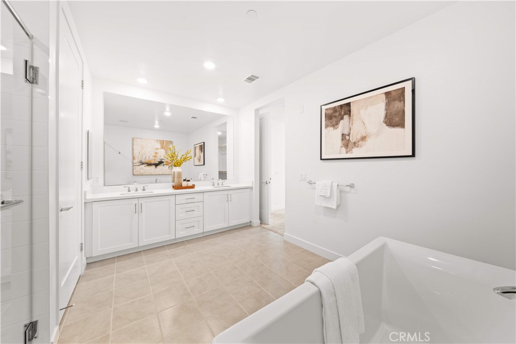 2510 Rivington Irvine, CA 92612 - Photo 27 of 41 a view of a kitchen with white cabinets