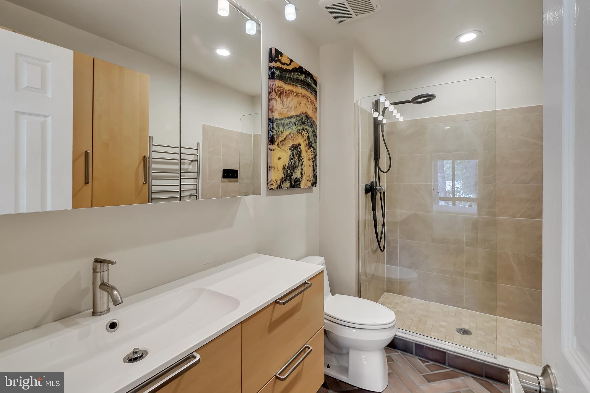 11604 Ivystone Court, Unit 6 Reston, VA 20191 - Photo 17 of 36 a bathroom with a sink toilet and shower