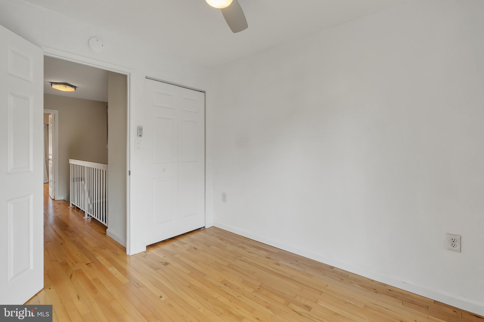 11604 Ivystone Court, Unit 6 Reston, VA 20191 - Photo 24 of 36 a view of an empty room with wooden floor and closet